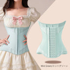 A mint green waist trainer corset shown on a model wearing a cream dress, alongside a standalone view of the corset on the right. The text 'Mint Green/ミントグリーン' is visible at the bottom right.
