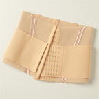 A beige mesh and fabric compression/support belt folded neatly on a light off-white background.
