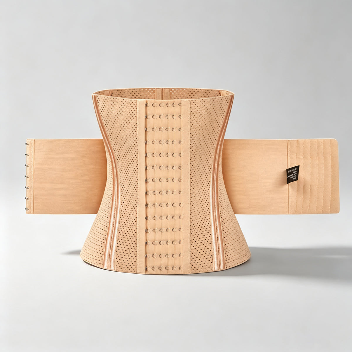 A beige waist trainer corset belt with a breathable perforated center panel, adjustable hook-and-eye closure, and elastic side bands, displayed against a light gray studio background.