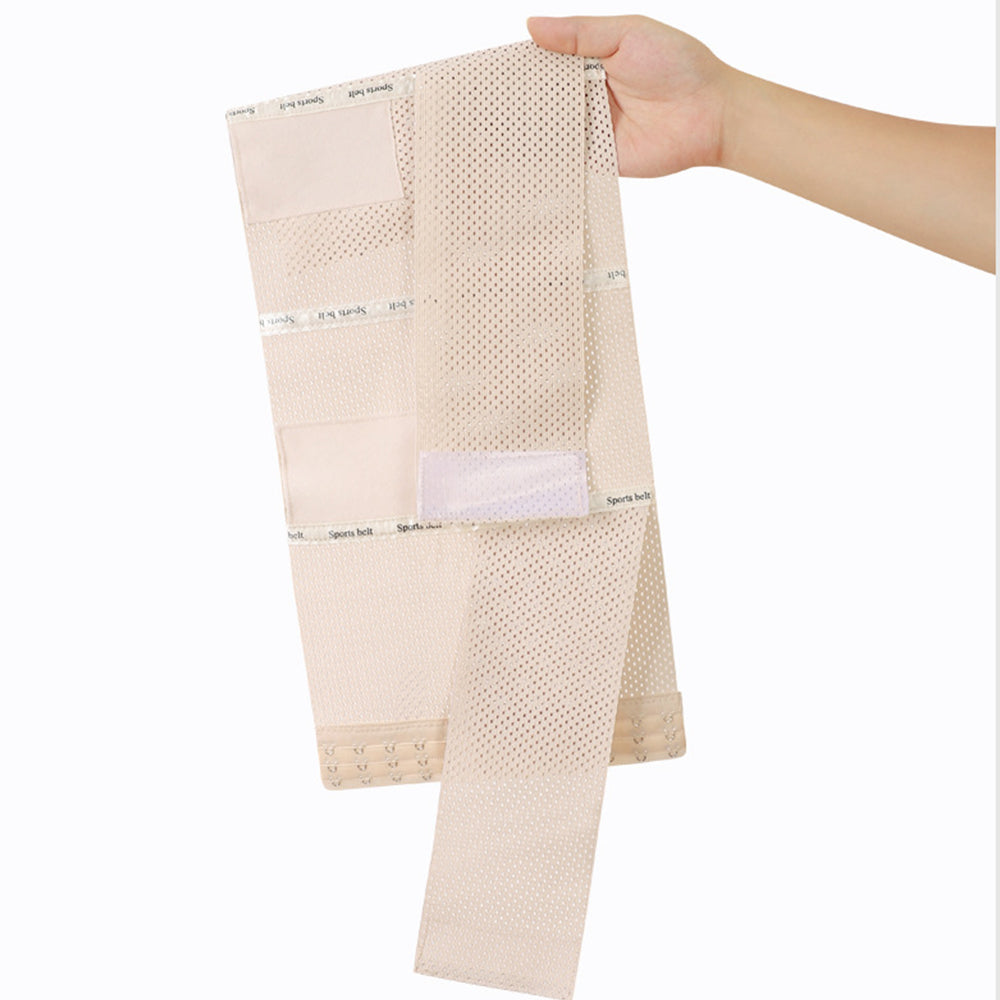 A beige mesh undergarment support belt with multiple elastic panels and hook-and-loop closures, held by a hand against a plain white background.